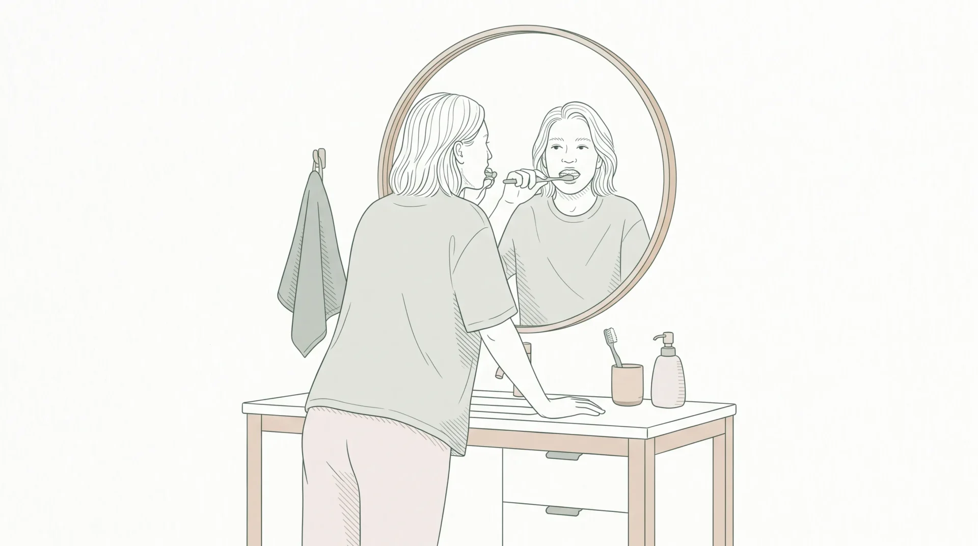 An adult checks their teeth in the bathroom before deciding whether to book a dental appointment.